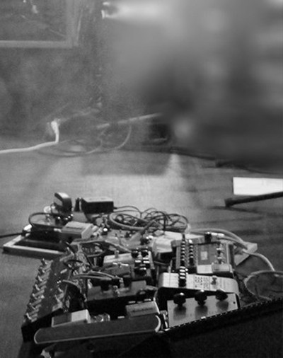 Pedalboard on stage, black and white